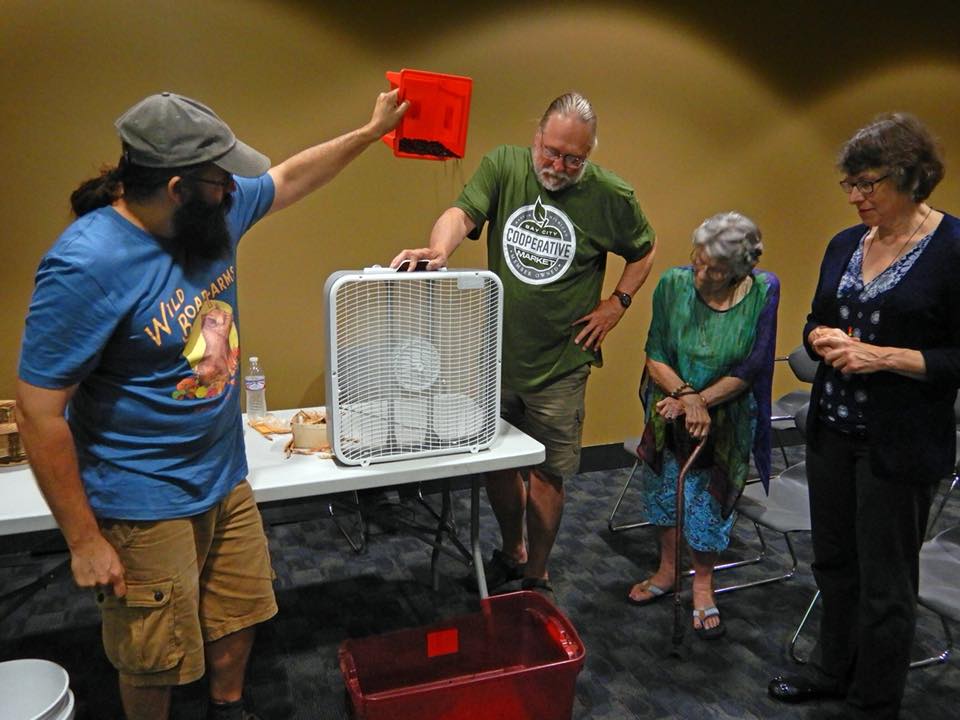 Bevin working with a small group at a educational event